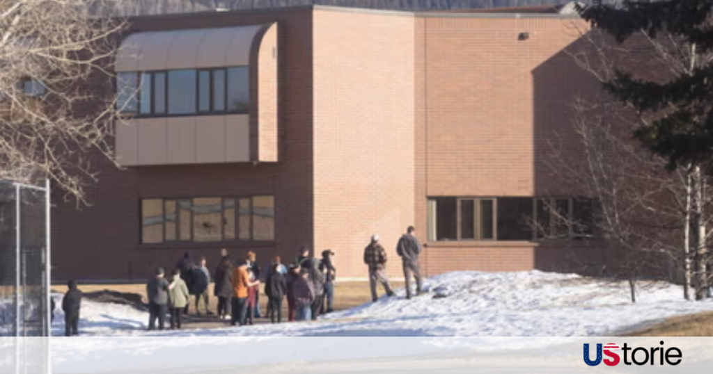 Police and emergency crews respond outside high school in Tumbler Ridge after shooting