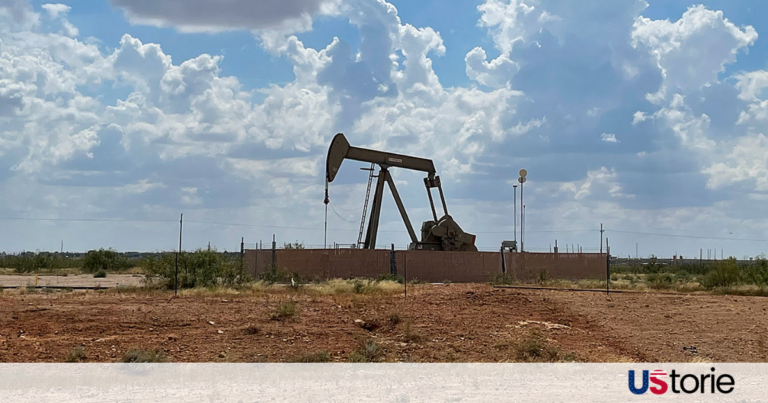 Oil refinery under a dark sky with market charts showing a sharp upward trend in March 2026