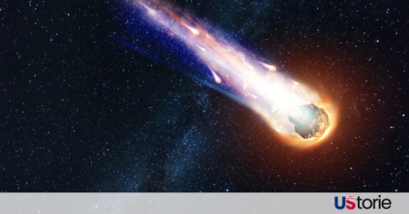 A bright green and orange fireball streaking across the night sky over the Cleveland skyline in March 2026