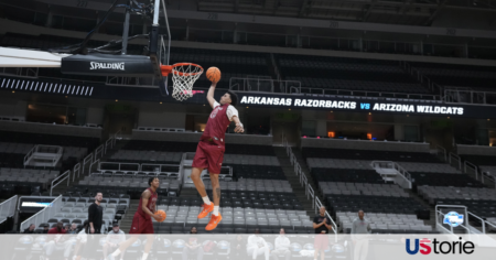 Arizona Wildcats players celebrating their dominant Sweet 16 victory over Arkansas at the SAP Center