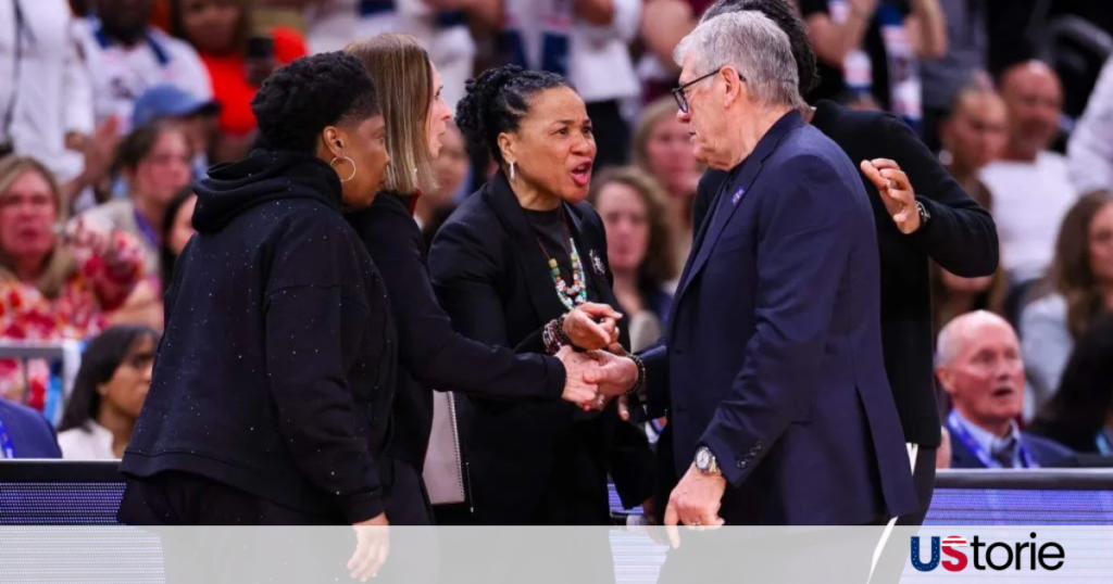 UConn coach Geno Auriemma and South Carolina coach Dawn Staley having a heated exchange at the scorer's table after the Final Four game.