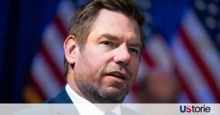 Rep. Eric Swalwell speaking at a podium during a California gubernatorial campaign town hall