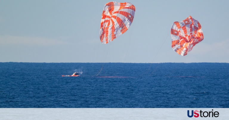 The Orion spacecraft Integrity floating in the Pacific Ocean after its successful splashdown, surrounded by Navy recovery teams