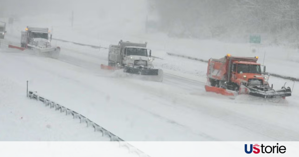 Snow-covered mountain highway in the Western U.S. during a severe winter storm warning.